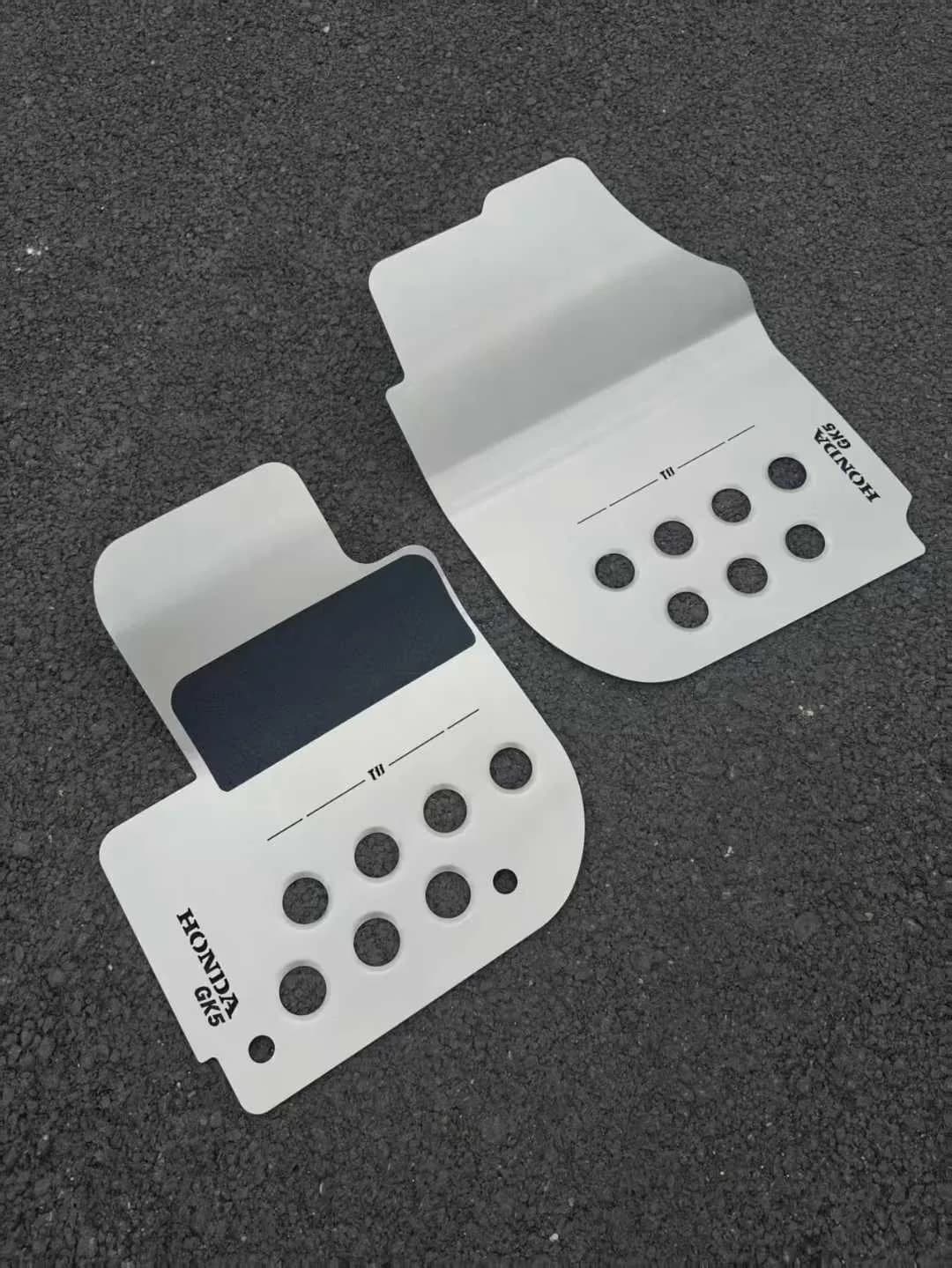 Actual compact perforated metal floor mat pair