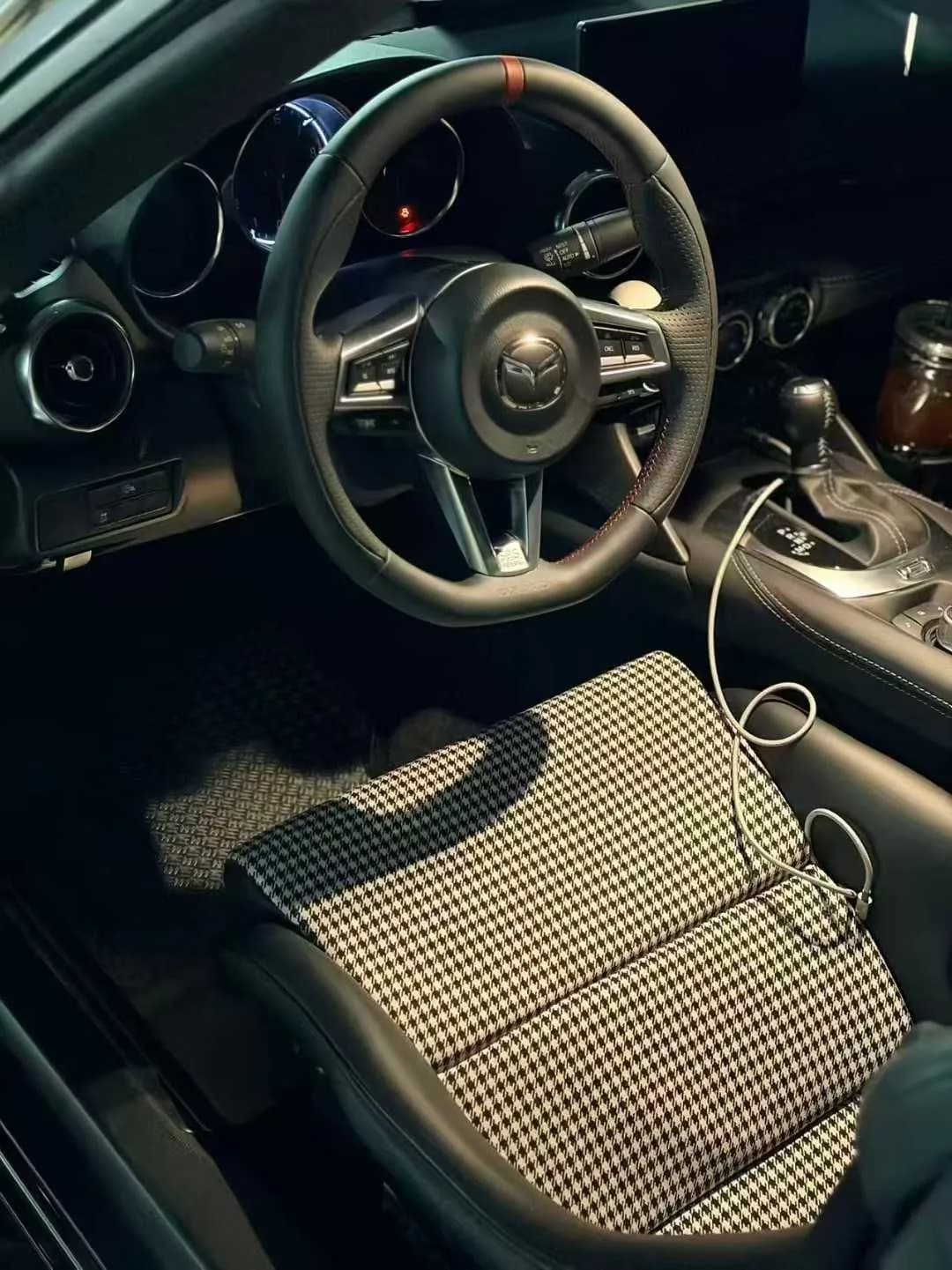 Actual perforated metal floor mat fitted in a daily-driver interior