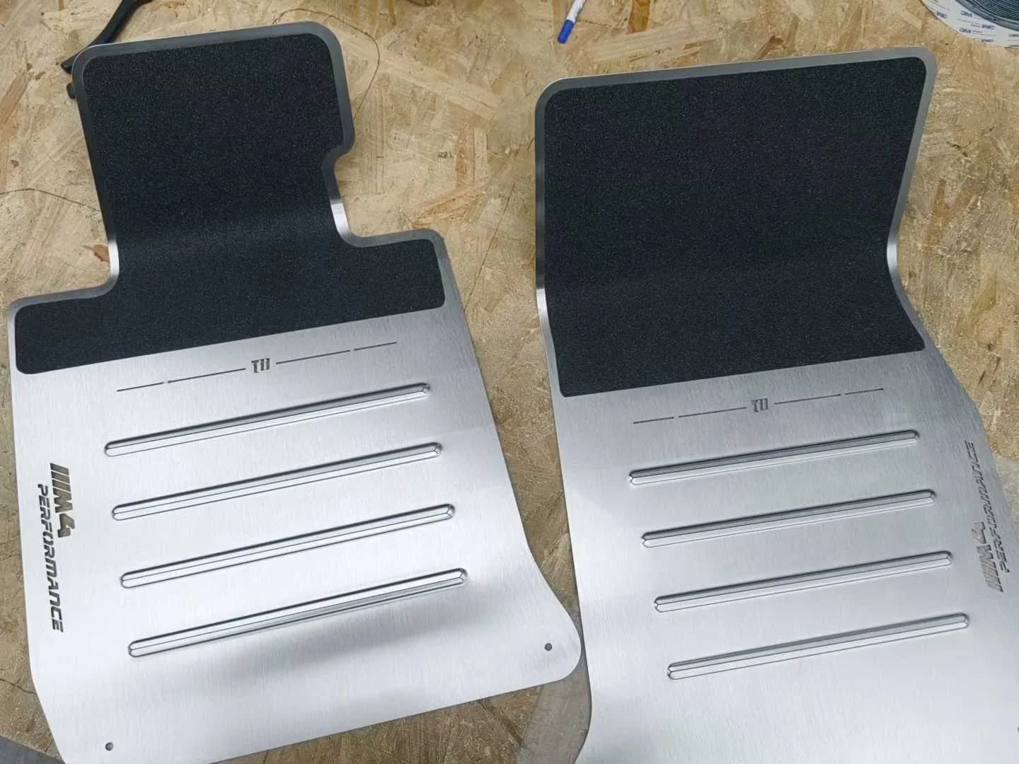 Actual brushed metal floor panel pair with horizontal raised ribs