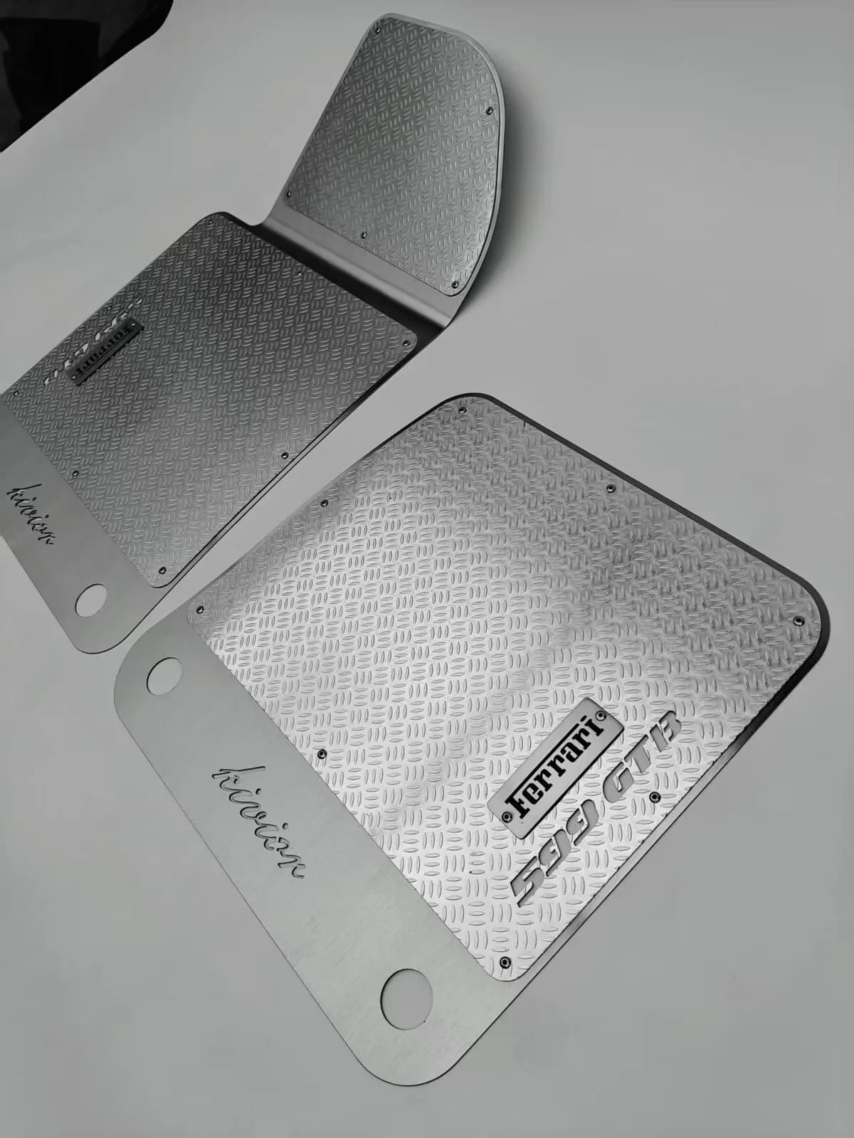 Actual formed silver metal floor panels with black upper sections