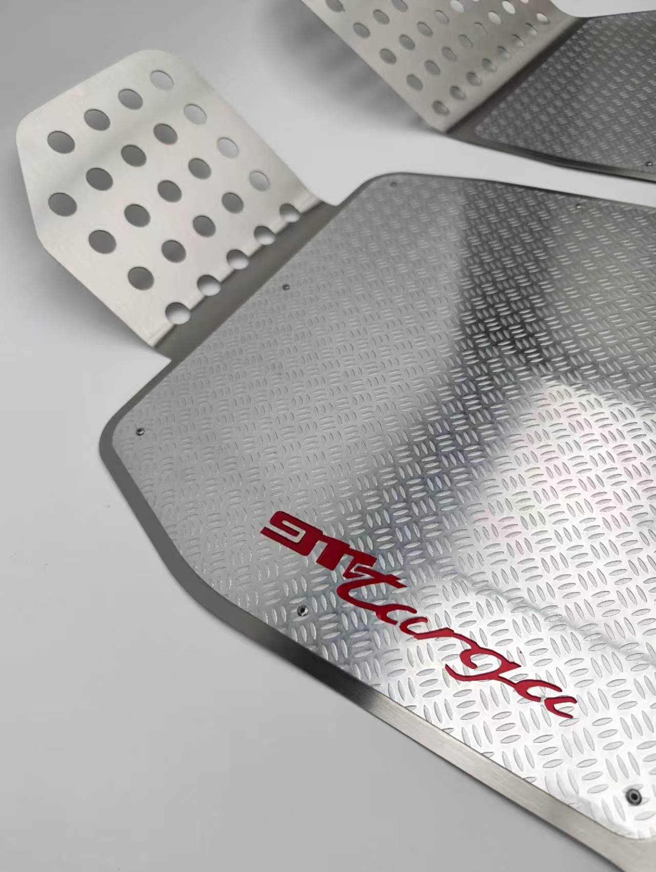 Actual double-layer metal mat showing a red color accent through cut artwork
